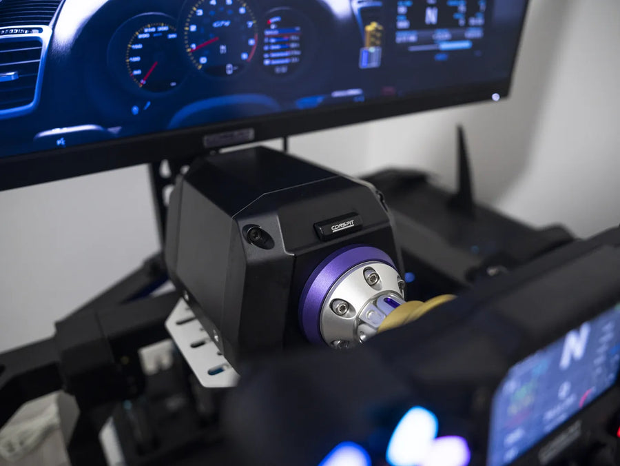 Conspit ARES wheelbase and steering wheel mounted in a sim rig in front of a monitor